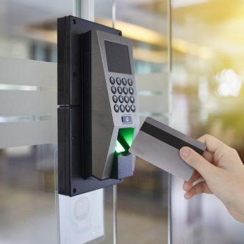 Young woman hold key card to access door office